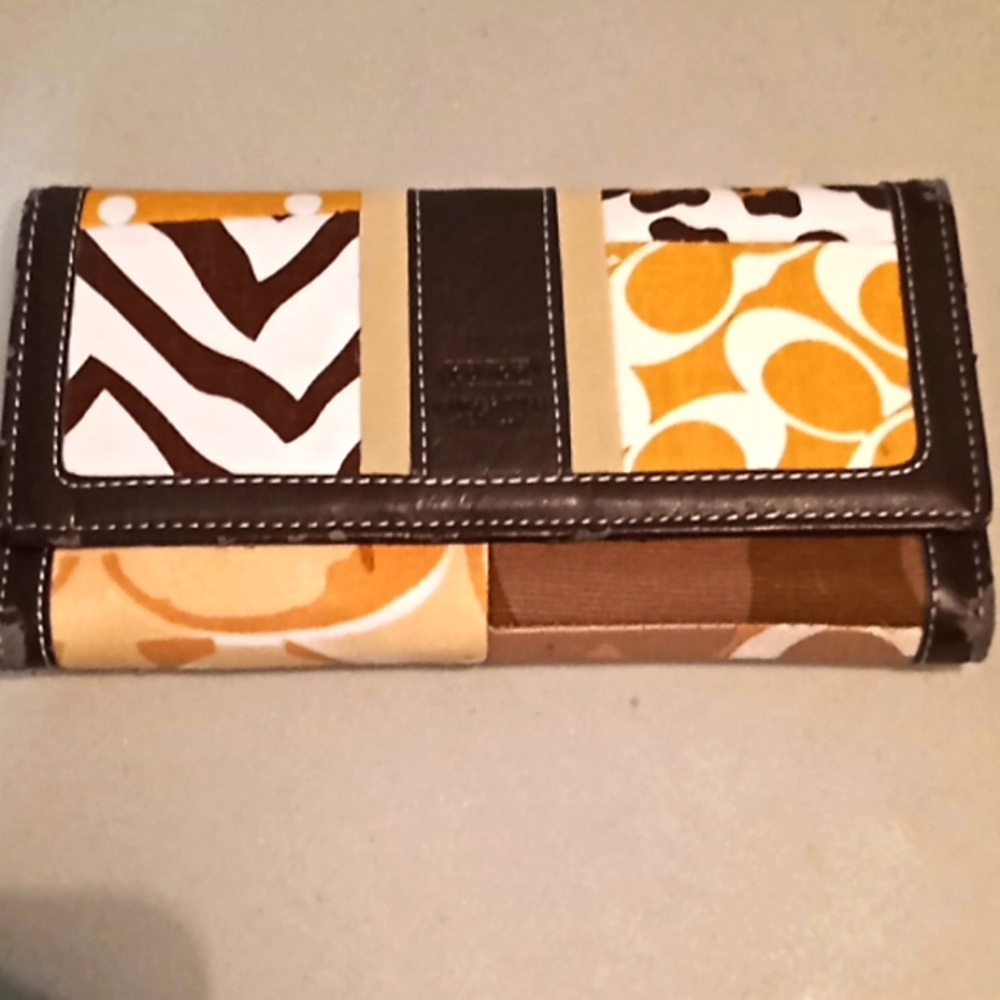 Coach leather and cloth wallet.